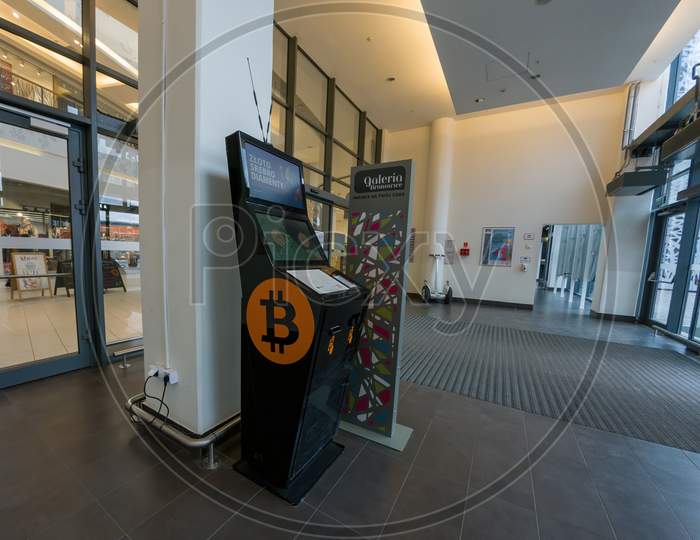 Krakow, Poland - April 28, 2021: Online Currency Bitcoin Vending Machine Cryptocurrency Dispenser In Shopping Centre Mall Entrance, Europe