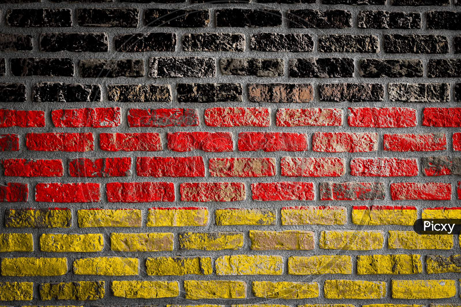 National Flag Of Germany
 Depicting In Paint Colors On An Old Brick Wall. Flag  Banner On Brick Wall Background.