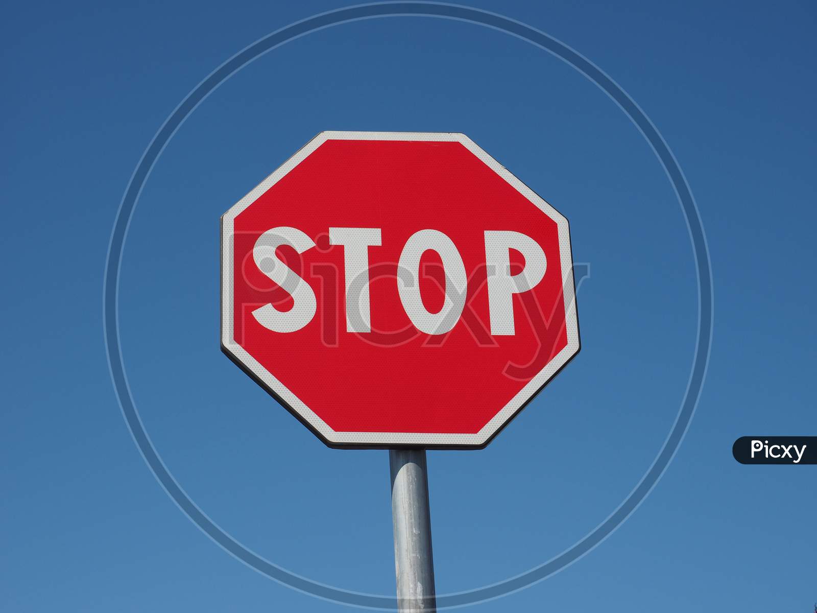 Stop Sign Over Blue Sky