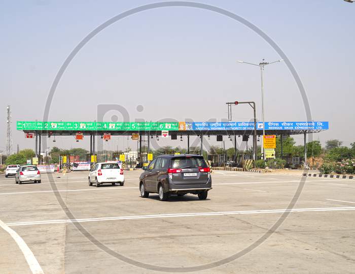 Vehicles Passing Through Toll Plaza. Checkout Point On The National Highway.