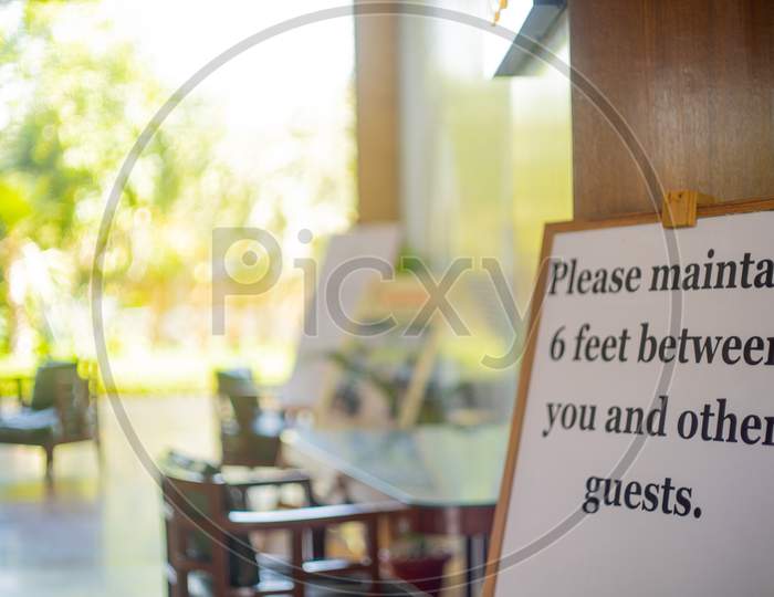 Social Distancing Sign Please Maintain 6 Feet Between You And Other Guests At A Restaurant Pub, Resort Hotel Spa As Businesses Open Up Gradually During The Covid19 Coronavirus Pandemic