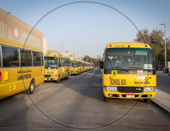 United Arab Emirates - 3 April 2021, Yellow Arabic School Bus Lined Up And Parked Outside The School Bus Parking At Abu Dhabi
