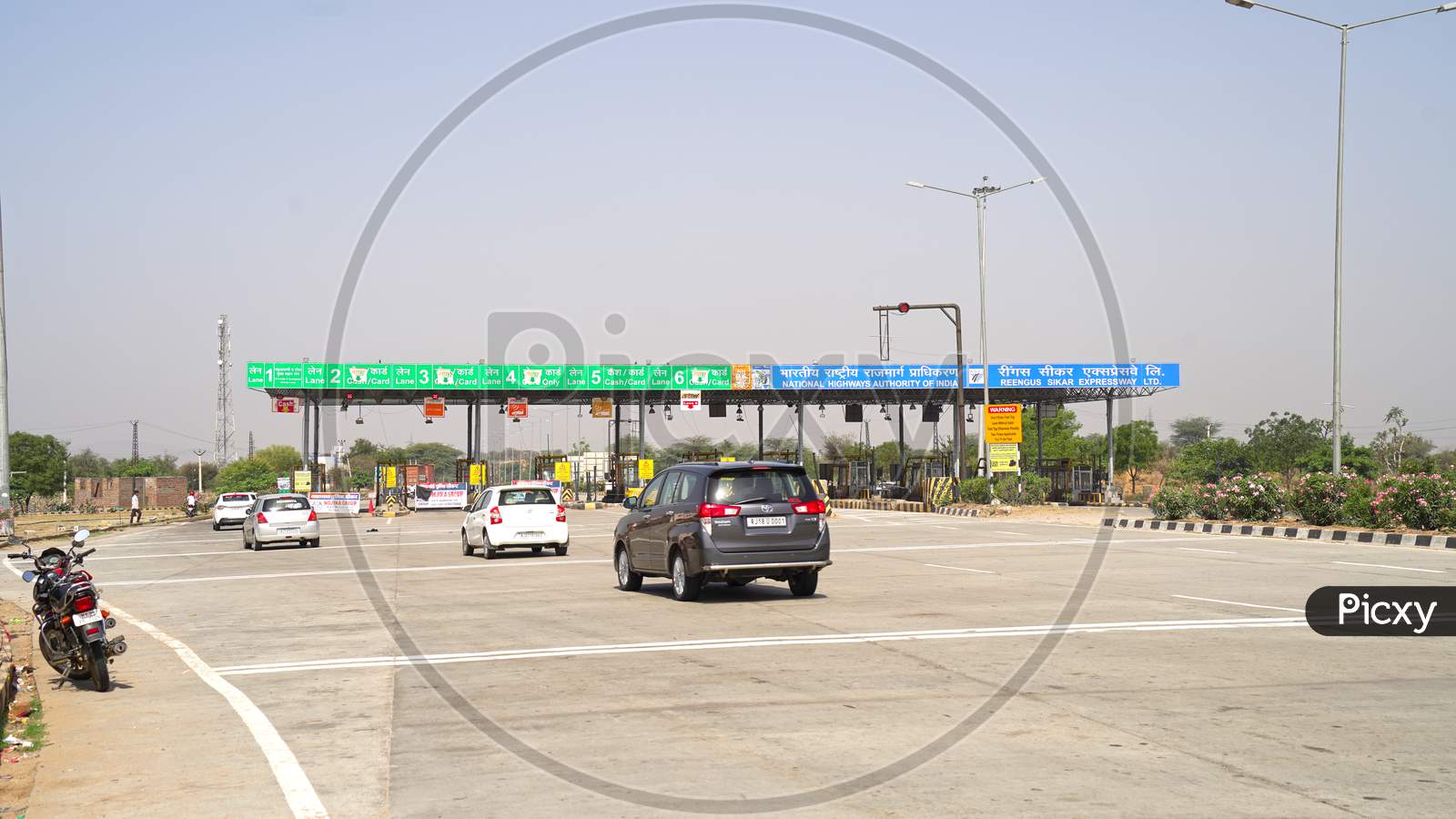 Vehicles Passing Through Toll Plaza. Checkout Point On The National Highway.