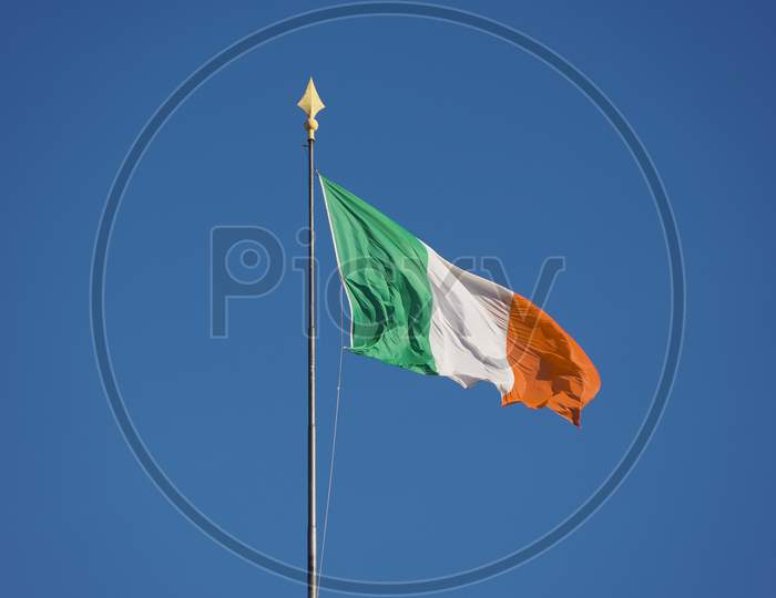 Irish Flag Of Ireland Over Blue Sky