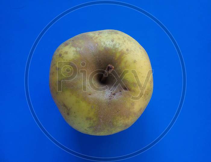 Green Apple Fruit Food Over Blue With Copy Space