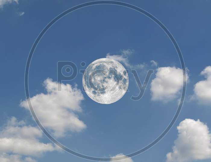 Full Moon Seen With Telescope Over Blue Sky