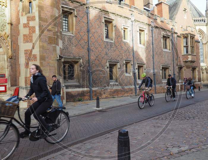 Cambridge, Uk - Circa October 2018: Bicycles In The City Centre, A Most Used Transport. Motion Blur On Forefront Woman.