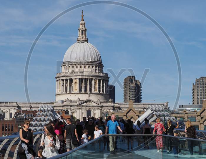 London, Uk - Circa September 2019: People Crossing Millennium Bridge Over River Thames Linking The City Of London With The South Bank Between St Paul Cathedral And Tate Modern Art Gallery