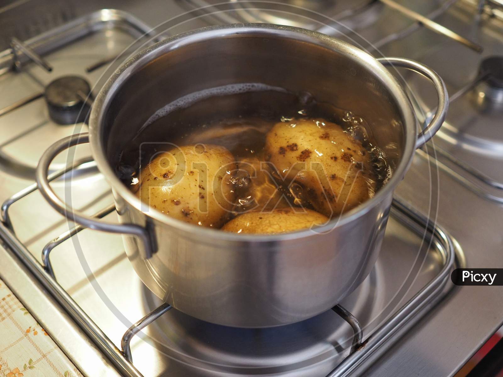 Boiling Potato In Saucepan