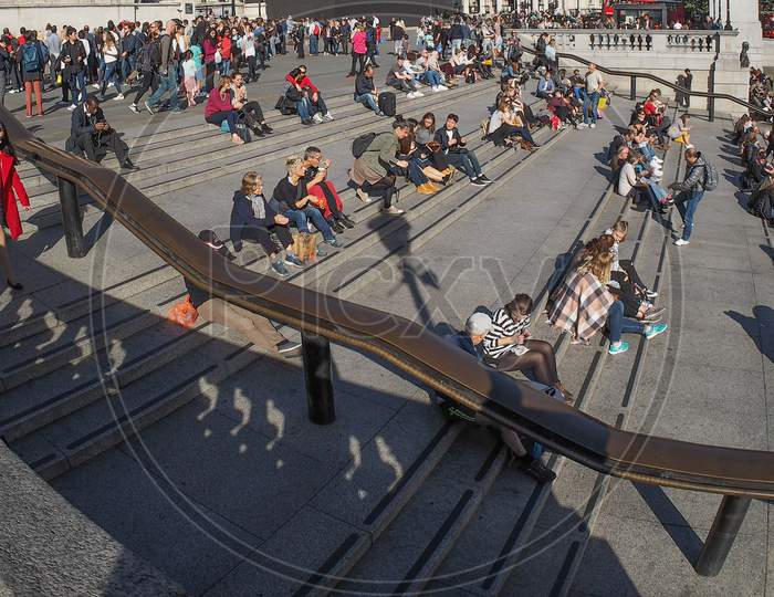 London, Uk - Circa September 2015: A Crowd Of People In Trafalgar Square, Seen With Wide Angle Fish Eye Lens