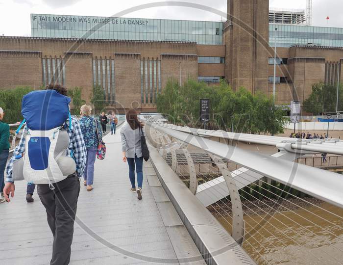 London, Uk - June 10, 2015: People Crossing The Millennium Bridge Linking The City Of London With The South Bank Between St Paul Cathedral And Tate Modern Art Gallery