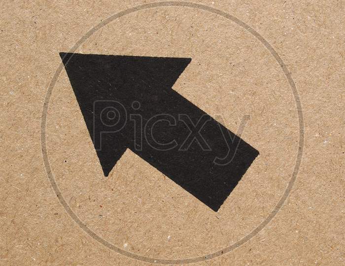 Black Arrow On Cardboard