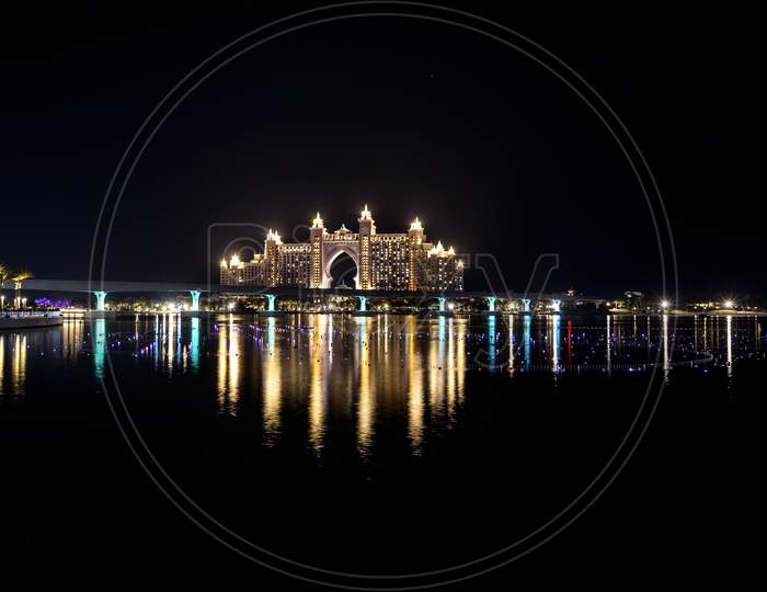 Dubai - Uae. 13Th November 2020. View Of The Atlantis Hotel With Colorful Reflection On Water From The Pointe Palm Jumeirah