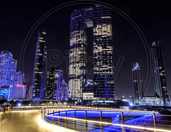 20Th Nov 2020. Beautiful Night View Of The Illuminated Skyscrapers At The Dubai Marina Captured From The Wharf Bridge Connecting Ain Dubai In Blue Water Islands, Dubai , Uae.