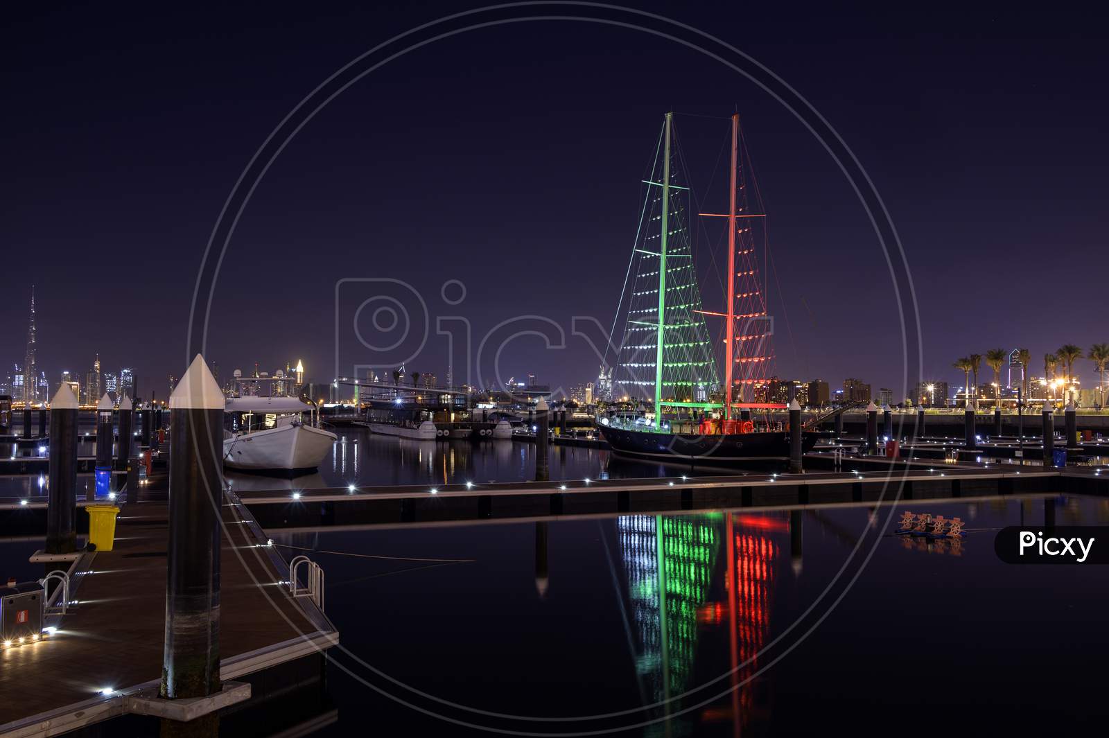 1St December 2020.Dubai Creek Harbor Skyline With Boats And Ships Illuminated In Flag Colours For The Uae National Day Captured At The Ras Al Khor, Dubai , Uae With The Burj Khalifa In The Background