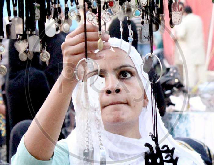 Girl selecting Jeweler in days of  muharram