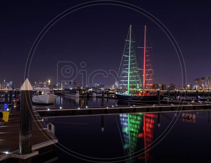 1St December 2020.Dubai Creek Harbor Skyline With Boats And Ships Illuminated In Flag Colours For The Uae National Day Captured At The Ras Al Khor, Dubai , Uae With The Burj Khalifa In The Background
