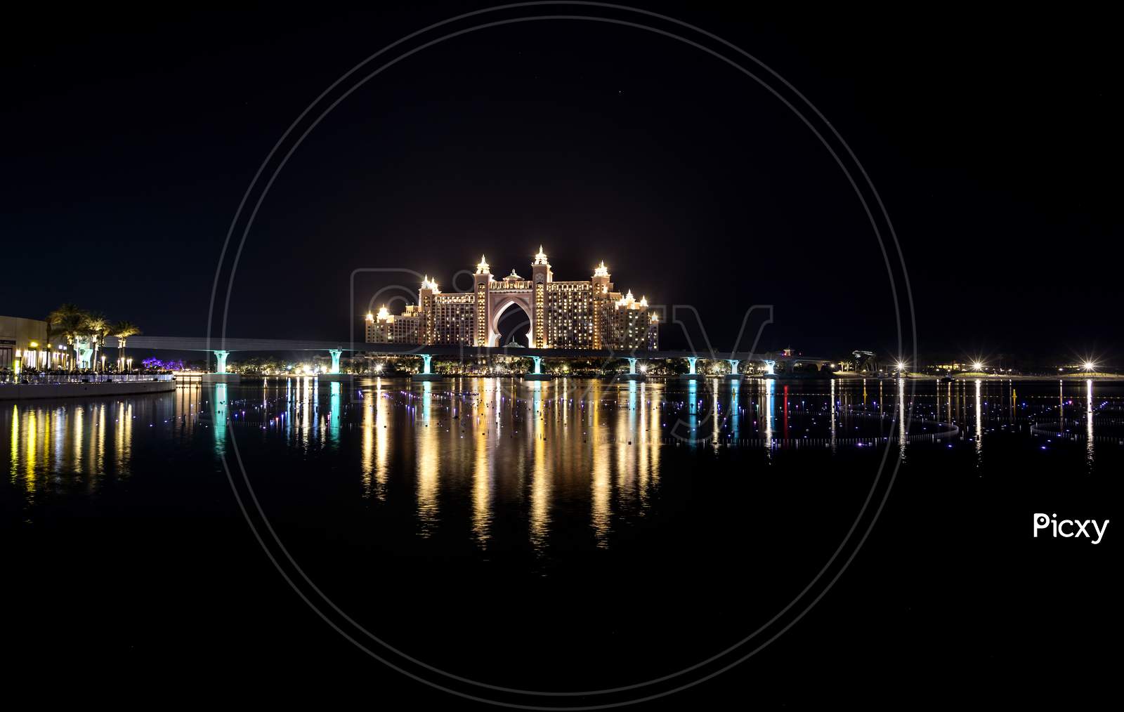Dubai - Uae. 13Th November 2020. View Of The Atlantis Hotel With Colorful Reflection On Water From The Pointe Palm Jumeirah