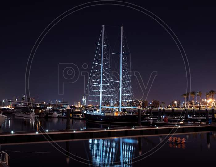 1St December 2020.Dubai Creek Harbor Skyline With Boats And Ships Illuminated In White Colors For The Uae National Day Captured At The Ras Al Khor, Dubai , Uae With The Burj Khalifa In The Background