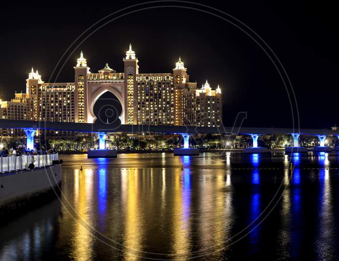 Dubai - Uae. 13Th November 2020. View Of The Atlantis Hotel With Colorful Reflection On Water From The Pointe Palm Jumeirah.