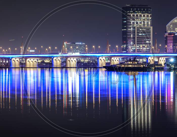 Nov 5 2020. Beautiful Night View Of The Illuminated Business Bay Bridge Across The Water With Reflections Surrounded By The Majestic Sky Scrapers Captured At The Business Bay , Dubai , Uae.