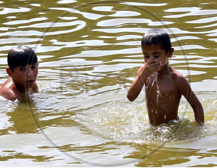 children are  enjoying in water