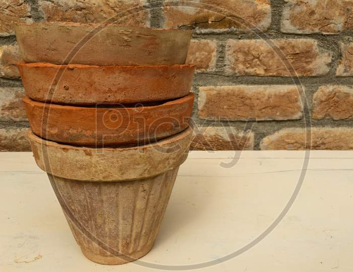 Old Pots Piled Close Up Look With A Text Space
