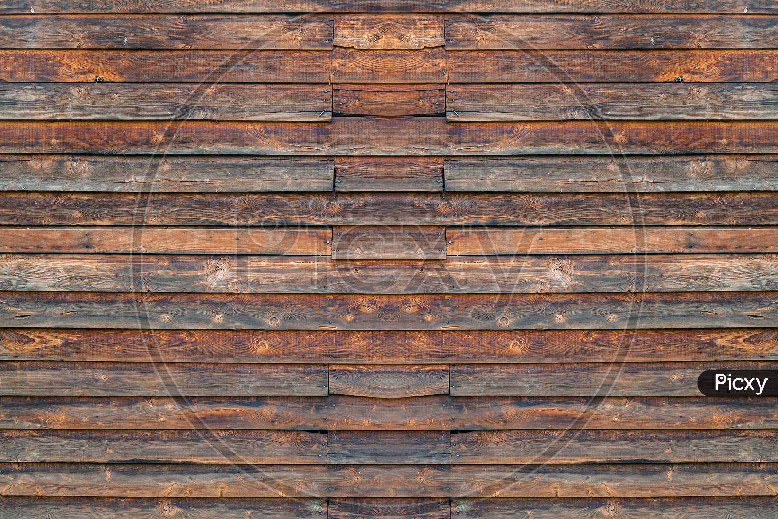 Close-Up Of A   Brown Wooden  Wall  Painted A Very Long Time And The Paint Peeled Off.  Brown Texture Background