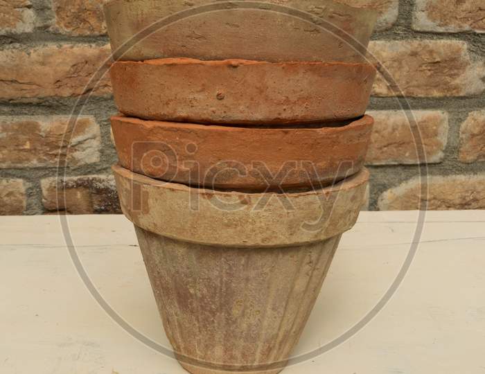 Used Clay Pots Stacked Or Aged Terra Cotta Pots Piled