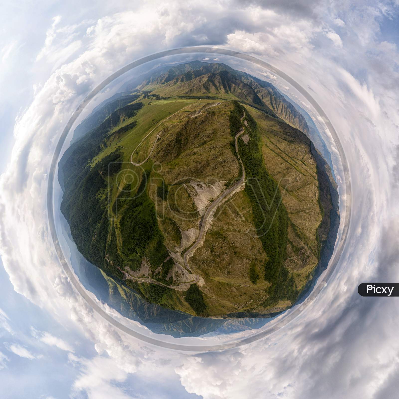 Helicopter Drone Shot. Aerial Photography Of A Mountain,  Green Field, Road, Small Village And Forest. Panoramic City 360  Shot From Above