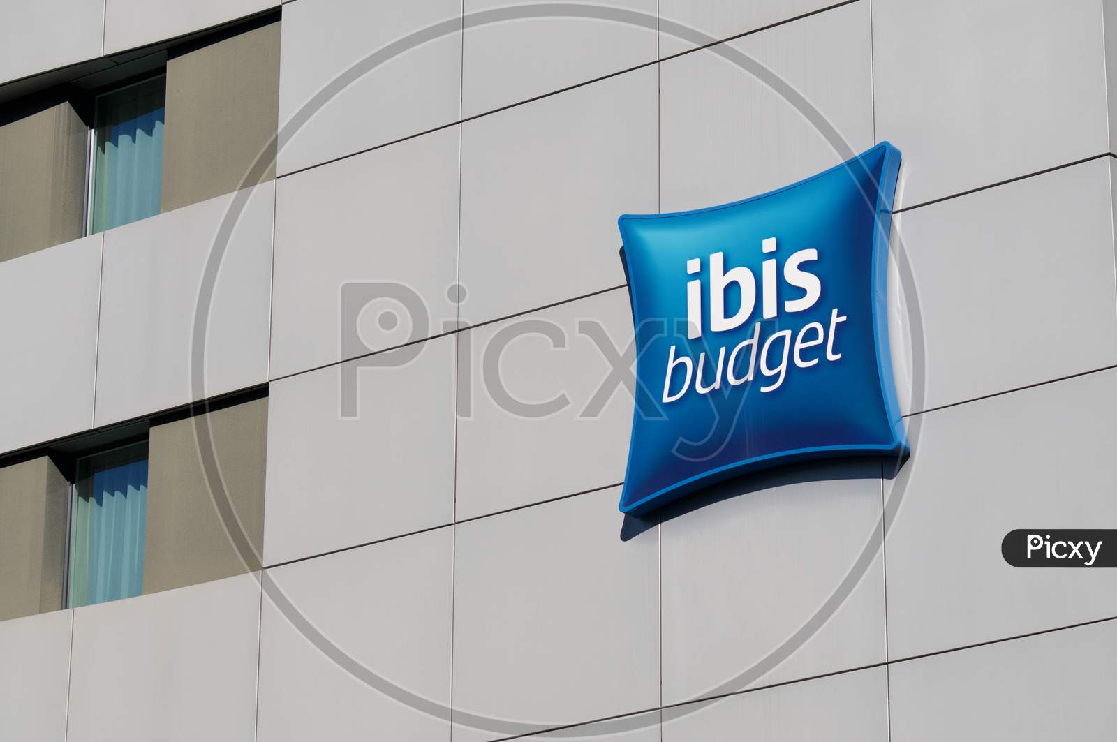 Ibis Budget Sign Hanging On Hotel Building In Lugano, Switzerland