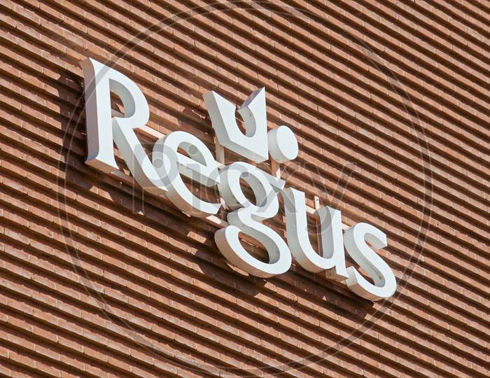 Regus Sign Hanging On A Building In Lugano, Switzerland
