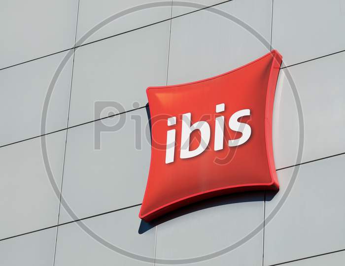 Ibis Hotels Sign Hanging On Hotel Building In Lugano, Switzerland