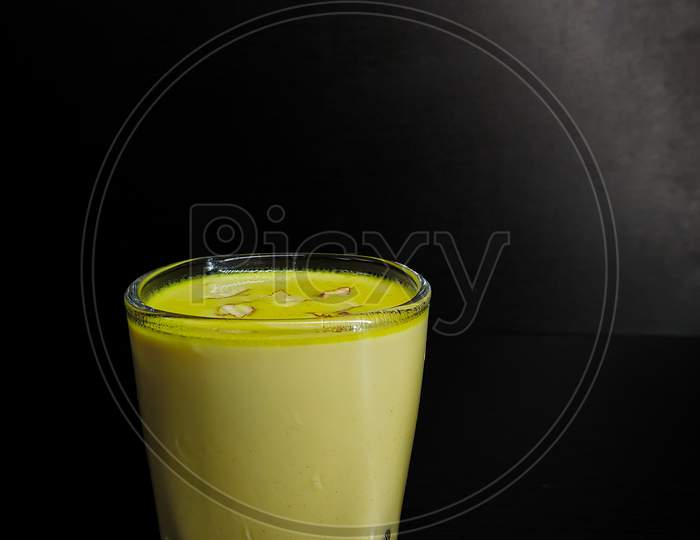 Badam milk in a dark and moody background