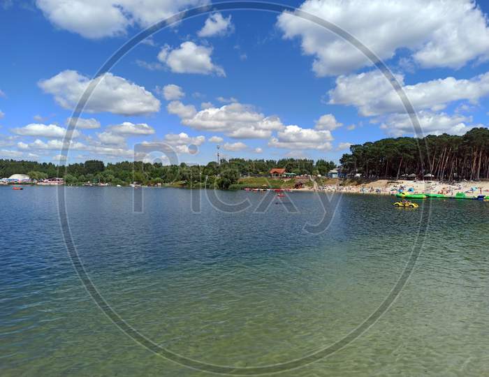 Wide Angle Shot Of A Man Made Lake Lagoon Named Kryspinow With Water Ride Boat Located In A Village In The Administrative District Of Gmina Liszki, Within Kraków County, Lesser Poland Voivodeship