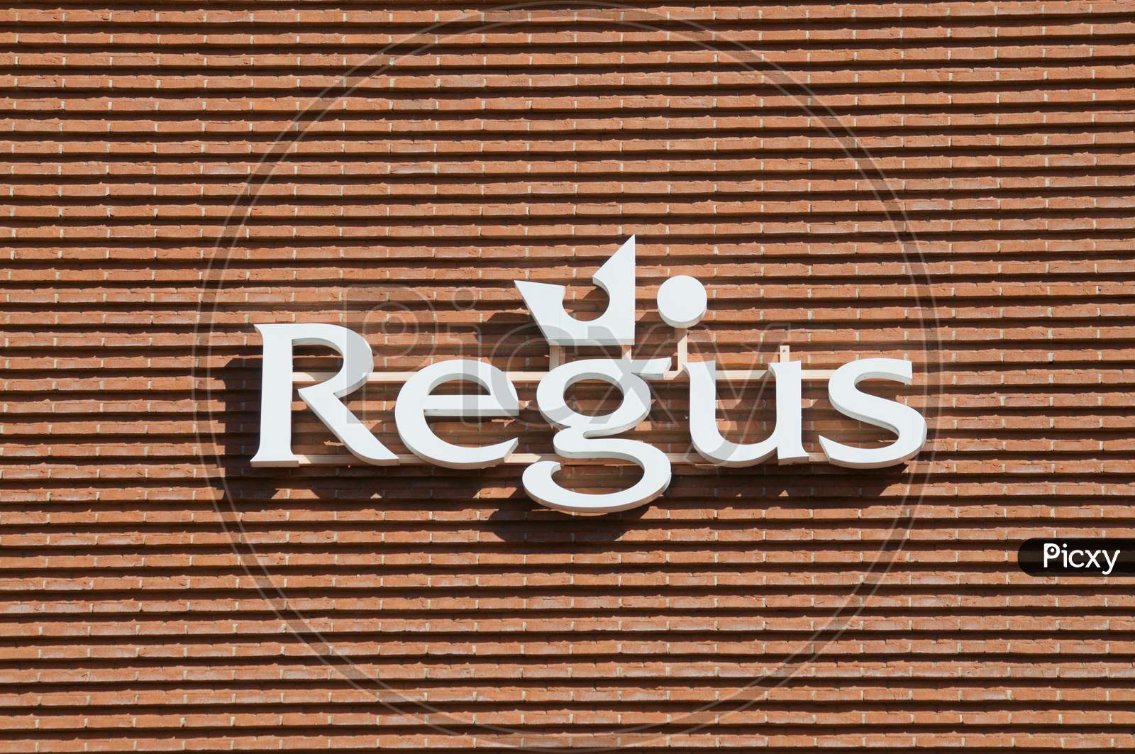 Regus Sign Hanging On A Building In Lugano, Switzerland