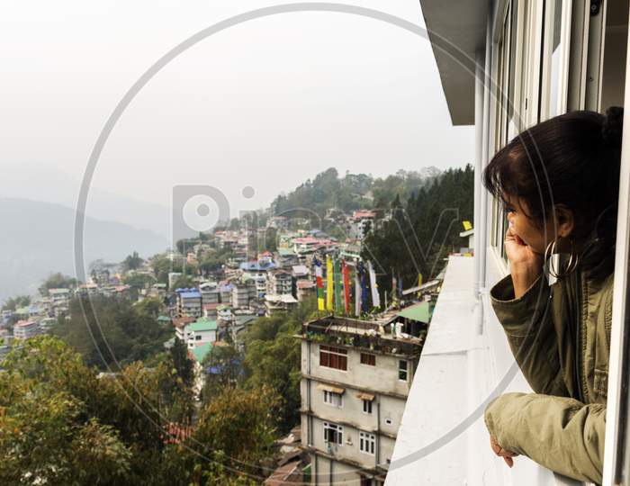 A Young Female Tourist Enjoying The View Of Beautiful Gangtok The Capital City Of Sikkim.