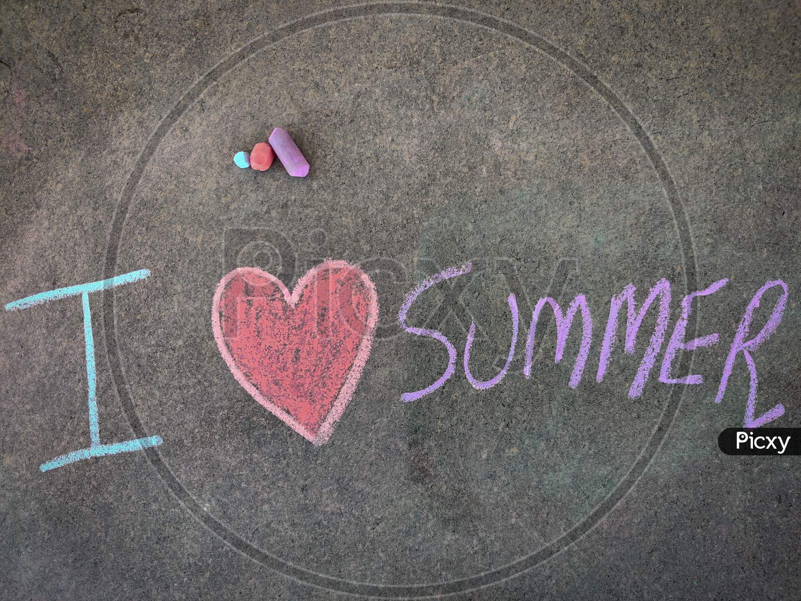 The Inscription Text On The Grey Board, I With Hand Drawn Love Symbol And Summer . (I Love Summer). Using Color Chalk Pieces.