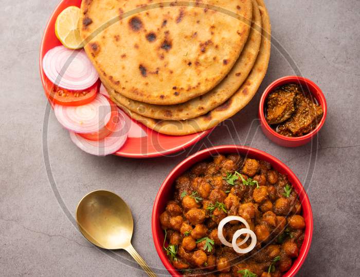 Aloo Paratha With Chole Masala Served Hot With Mango Pickle. Indian Food