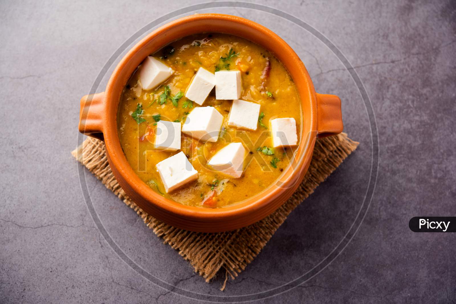 Butter Dal Fry Paneer Masala Is An Indian Food Recipe Served In A Bowl