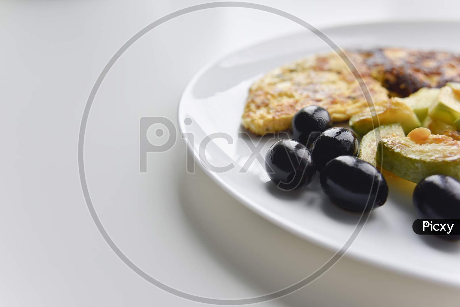 Selective Focus At The Breakfast On The White Plate