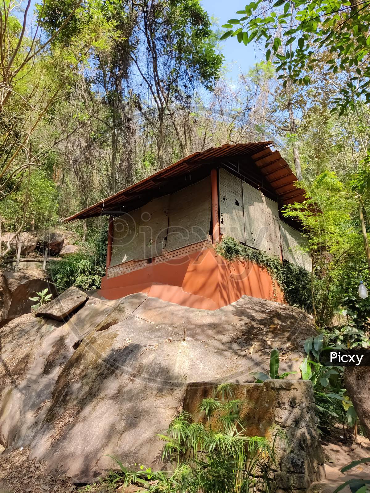 Ancient Home Over The Rocks In The Forest