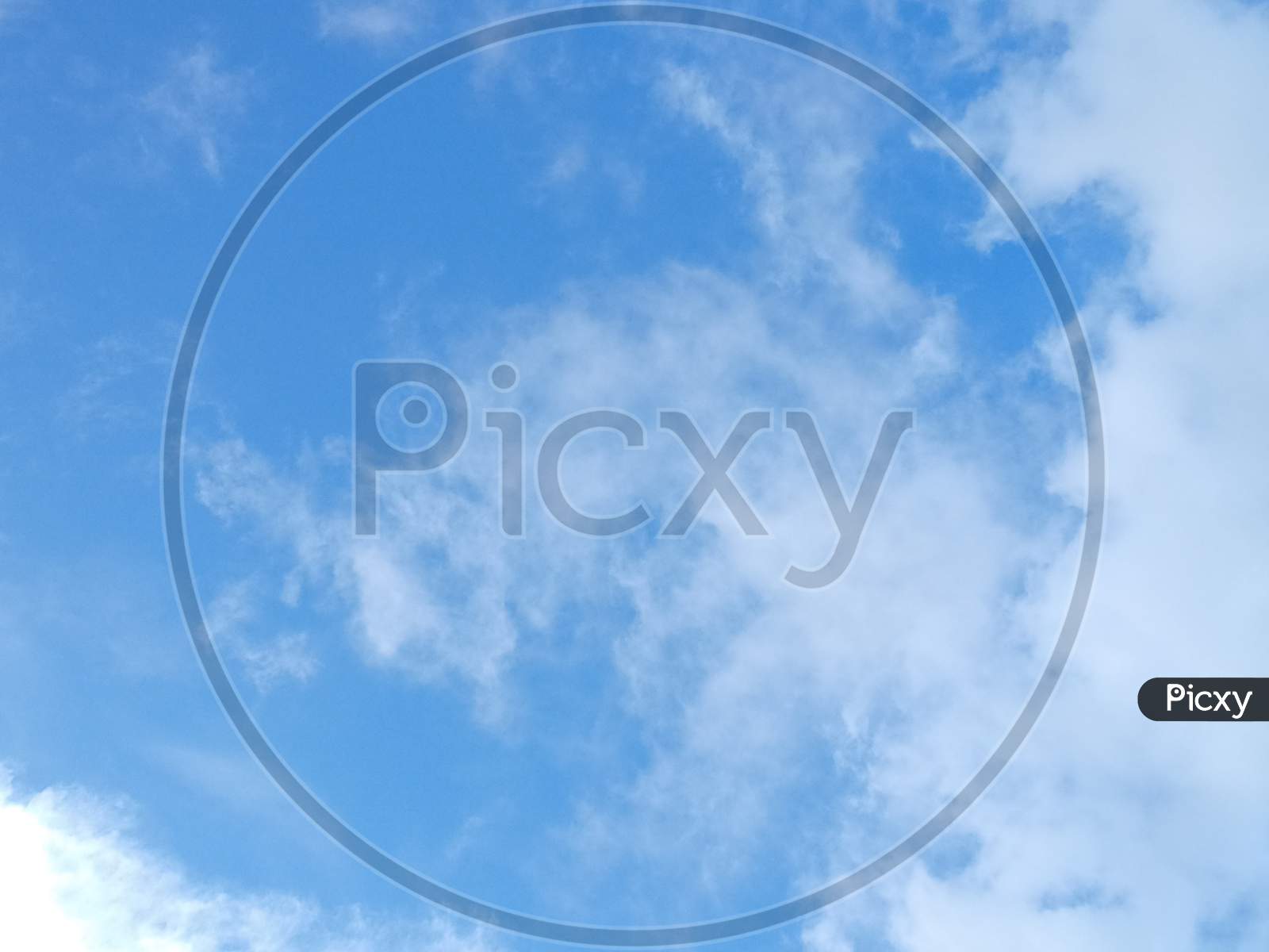 Sunny Blue Sky With Clouds Background