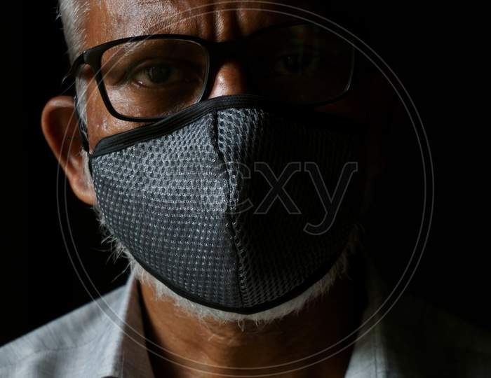 Portrait of 60-year-old Indian man wearing mask