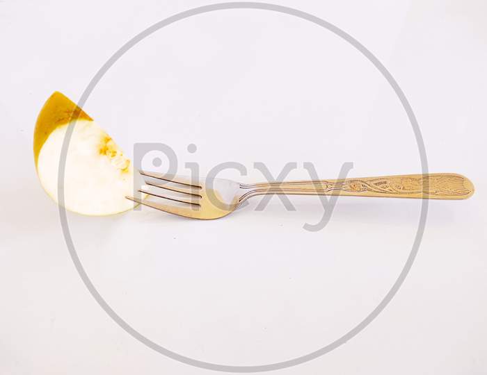 A cut apple in fork