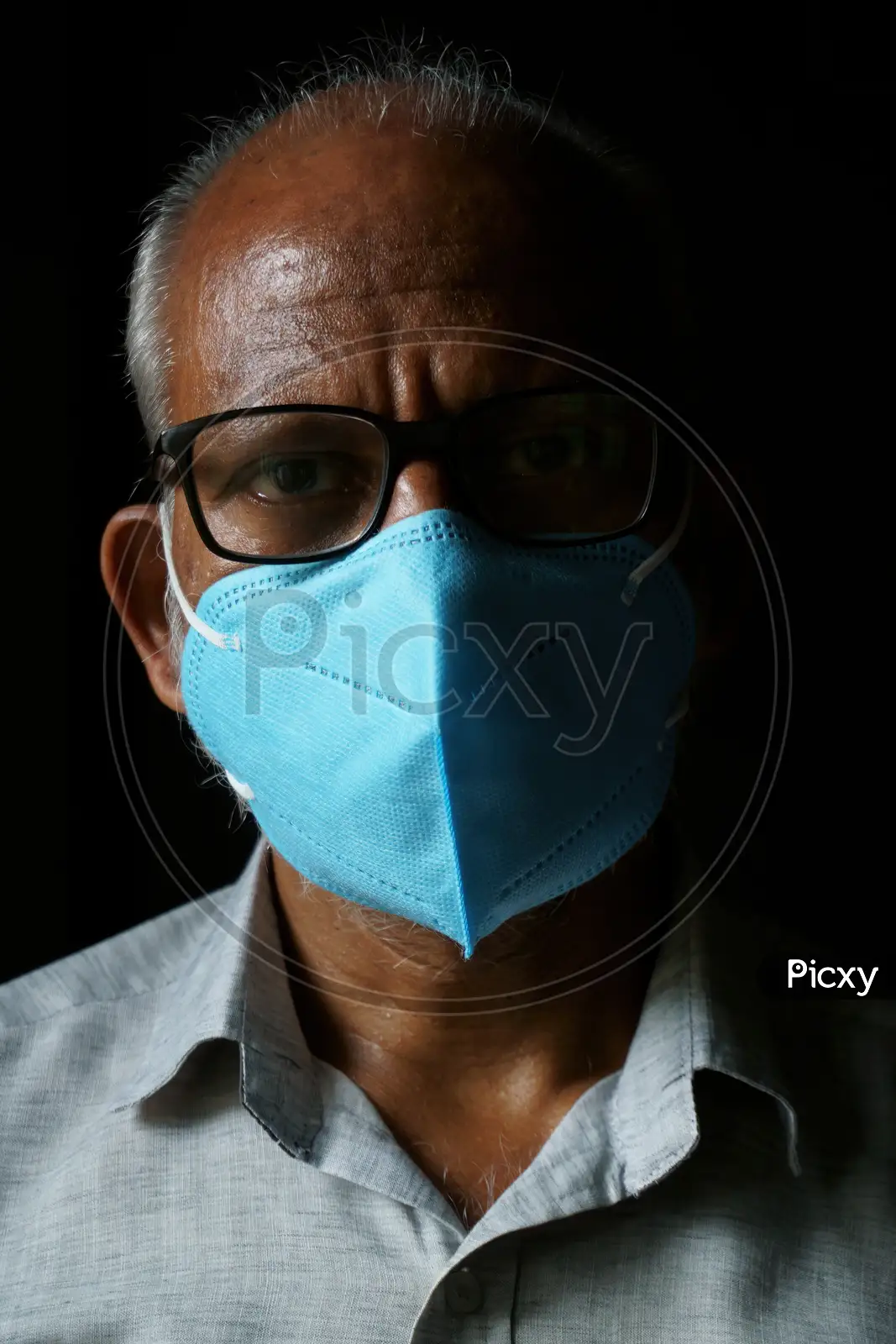 Image of Portrait of 60-year-old Indian man wearing mask-DP247327-Picxy