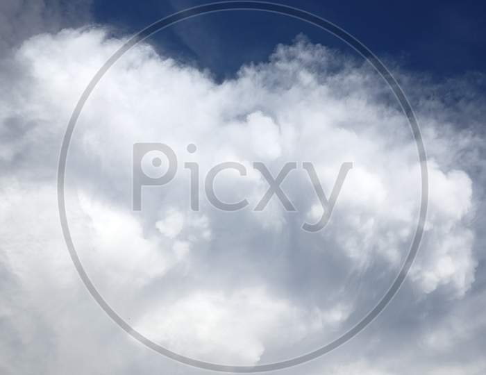 A Cumulonimbus Cloud. White Clouds In The Blue Sky