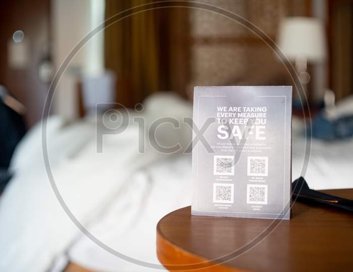 Shallow Depth Of Field Shot Showing Coronavirus Covid19 Guidelines Using Qr Code For Contactless Menu, Room Service, Travel Guide And More