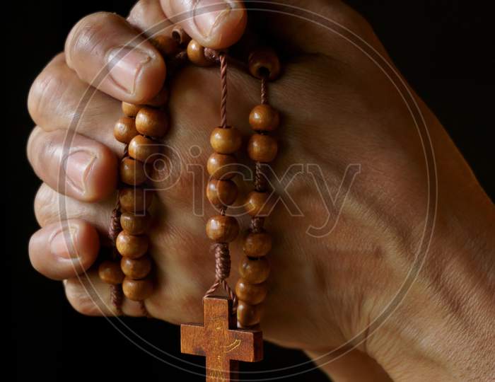 Praying hands of an old Indian Catholic woman