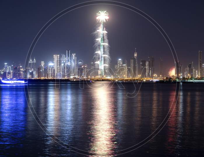 Jan 1St,2021, Dubai,Uae. View Of The Spectacular Fireworks At The Burj Khalifa Illuminated With The Uae Flag Colors During The New Year 2021 Celebration Captured From The Creek Harbor , Dubai , Uae.